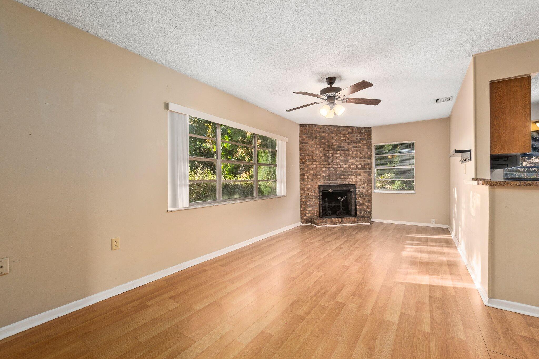5901 Sunset Boulevard Fort Pierce, FL 34982 - Photo 15 of 26 a view of an empty room with a fireplace and a window