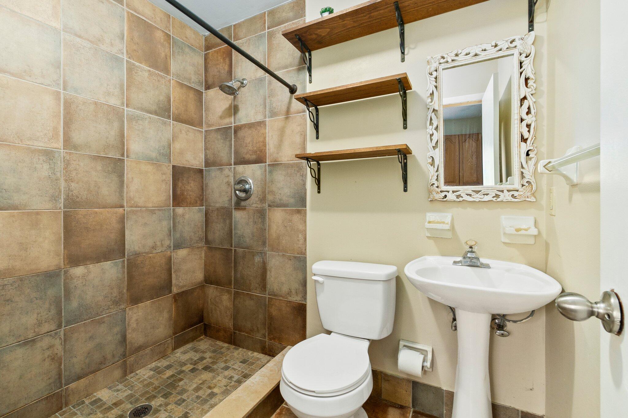 5901 Sunset Boulevard Fort Pierce, FL 34982 - Photo 22 of 26 a bathroom with a sink toilet and shower