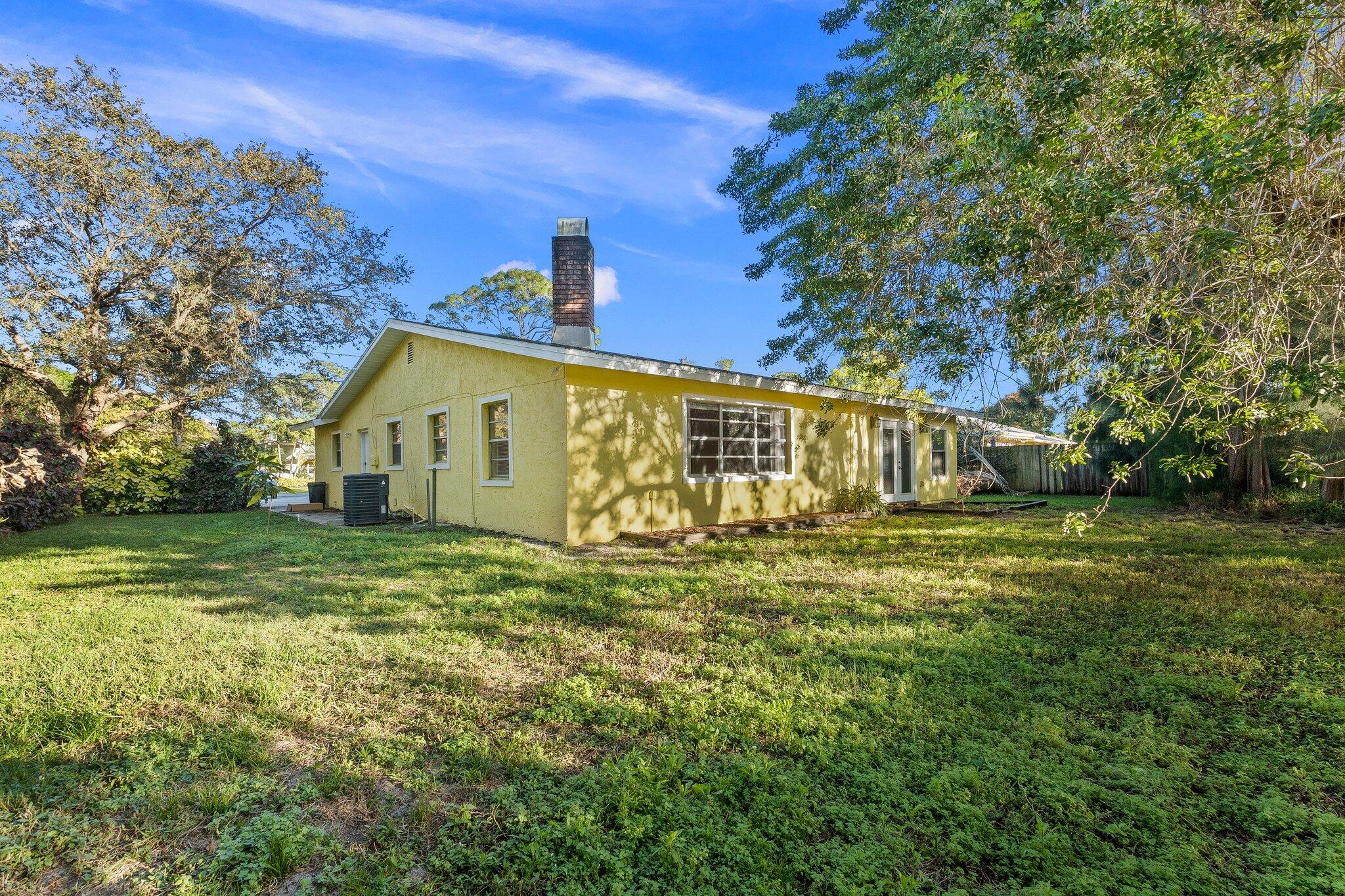 5901 Sunset Boulevard Fort Pierce, FL 34982 - Photo 26 of 26 a view of a house with a yard
