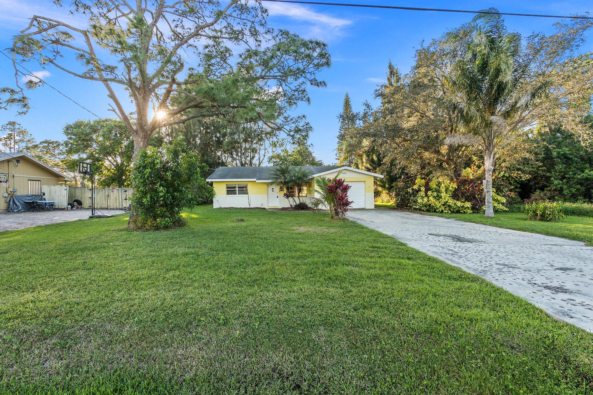 5901 Sunset Boulevard Fort Pierce, FL 34982 - Photo 3 of 26 a view of a house with a yard