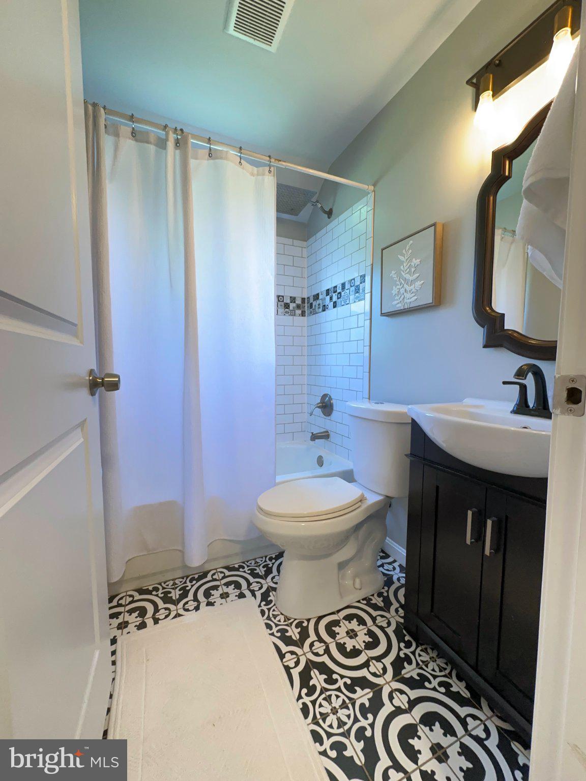 7711 Fairgreen Road Dundalk, MD 21222 - Photo 12 of 18 Chic bathroom with elegant tile design.