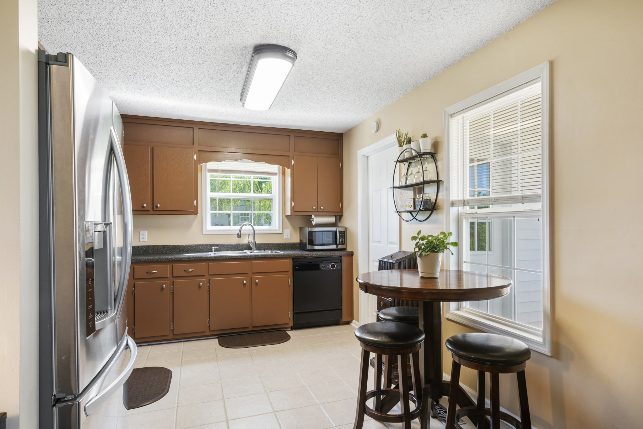 5795 Clear Creek Road Pulaski, TN 38478 - Photo 8 of 25 a kitchen with granite countertop cabinets and chairs
