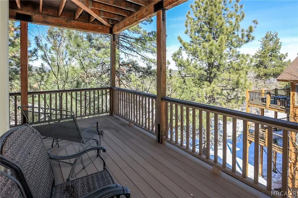 a bathroom with a granite countertop toilet sink and mirror