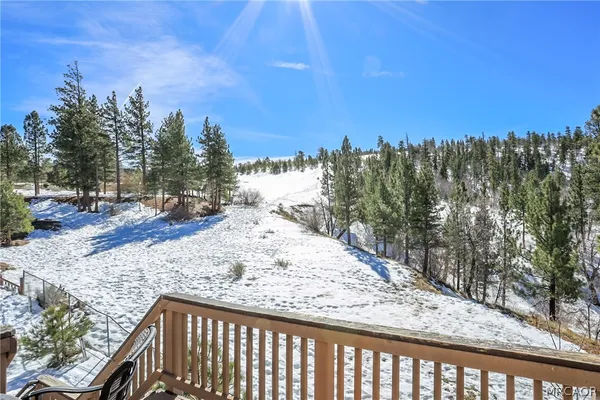a view of a terrace with trees in the background