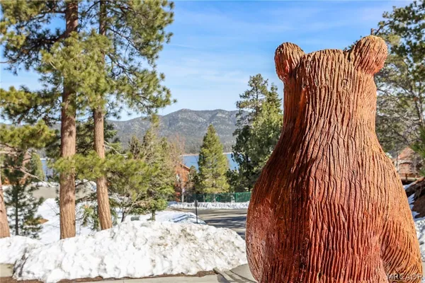 a living room with lots of furniture and wooden floor