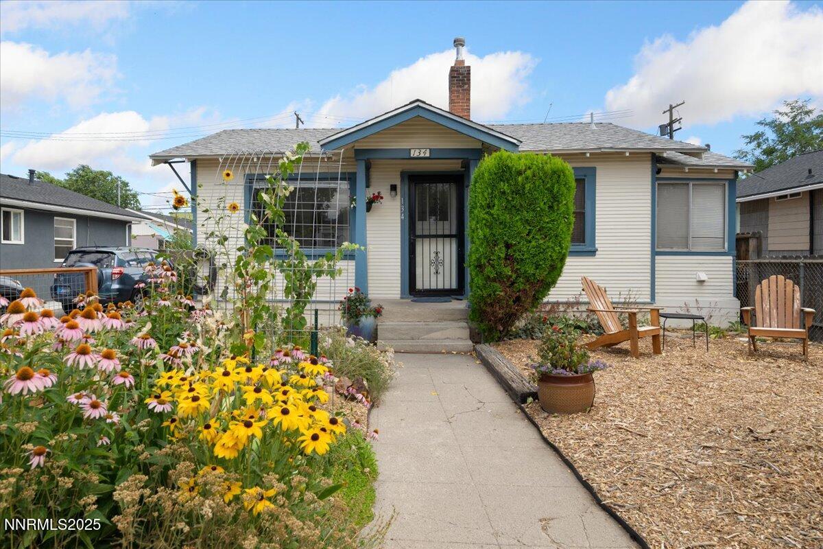 154 East Arroyo Street Reno, NV 89502 - Photo 1 of 36 a front view of a house with a garden