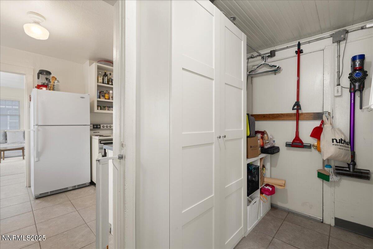 154 East Arroyo Street Reno, NV 89502 - Photo 13 of 36 a view of a storage & utility room with a refrigerator