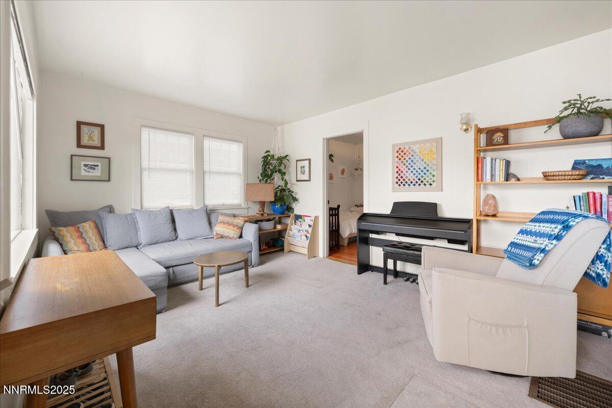 154 East Arroyo Street Reno, NV 89502 - Photo 2 of 36 a living room with furniture and a window