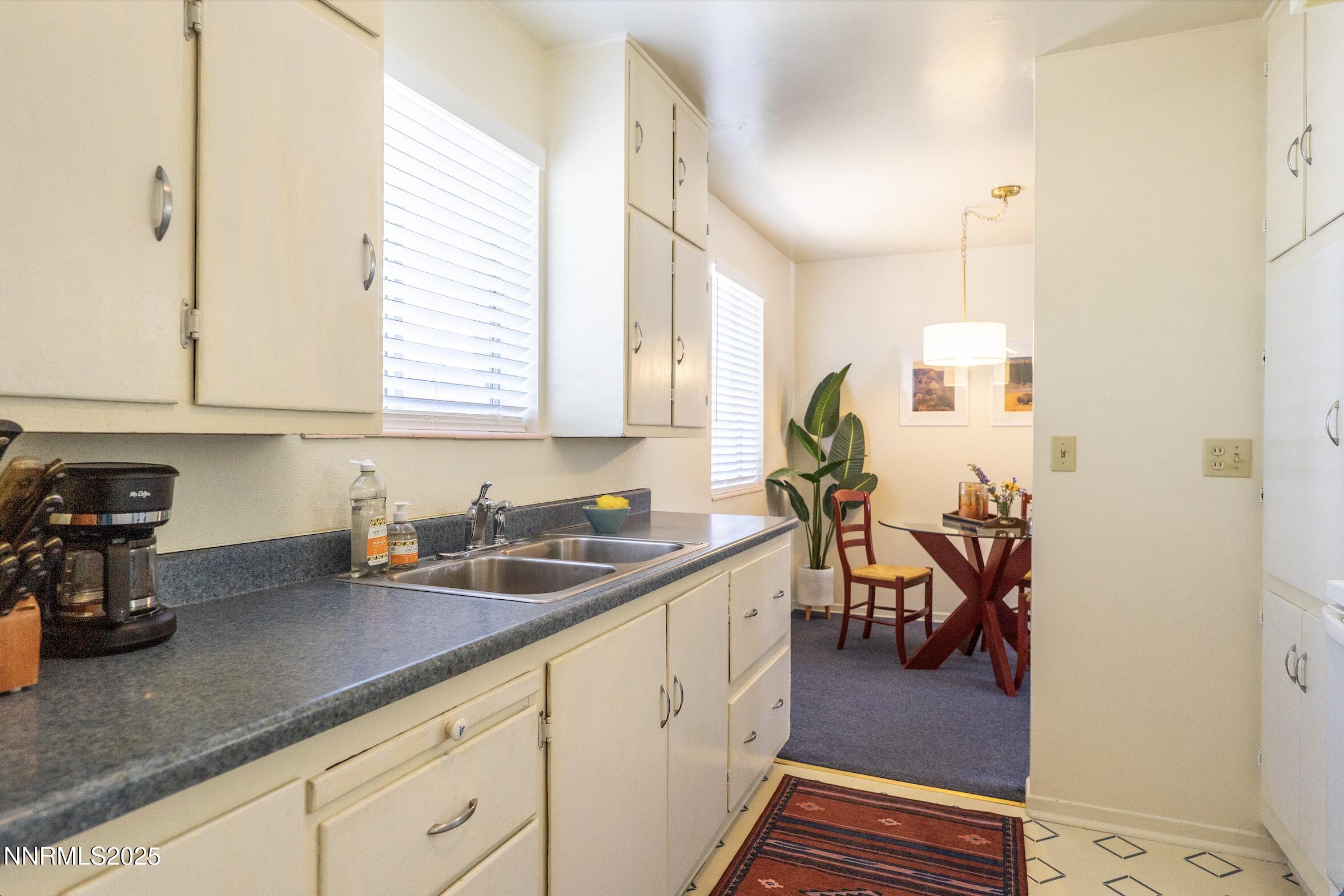 154 East Arroyo Street Reno, NV 89502 - Photo 21 of 36 a kitchen with sink and cabinets