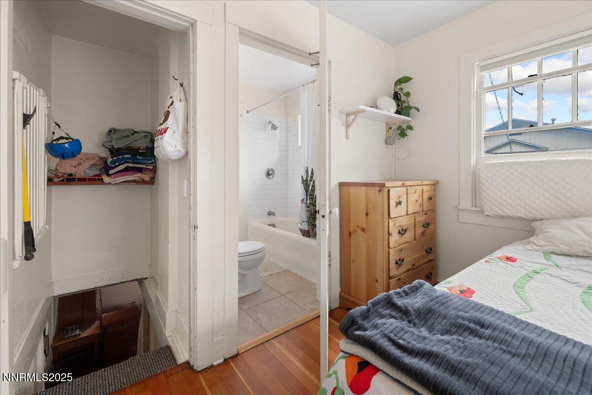 154 East Arroyo Street Reno, NV 89502 - Photo 8 of 36 a bedroom with a bed and a window