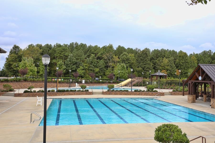 8612 Lasilla Way Raleigh, NC 27616 - Photo 26 of 27 The pool complex is a wow, and waiting to cool you off on hot summer evenings. Neighborhood Amenities