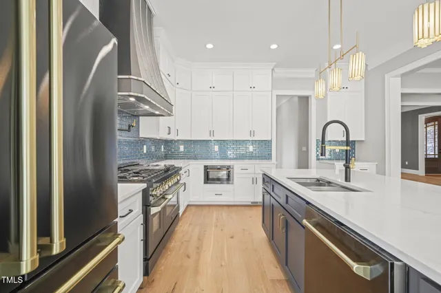 a stove top oven sitting inside of a kitchen