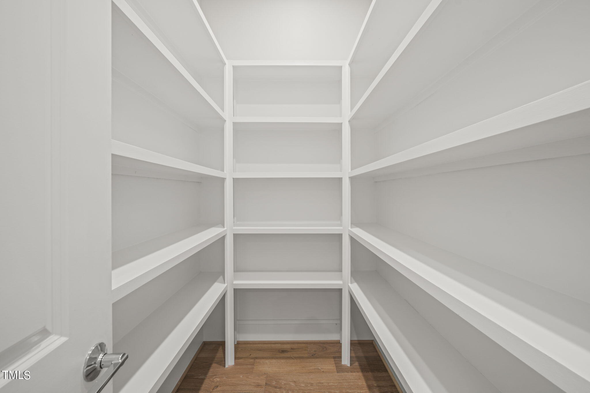 109 November Drive Durham, NC 27712 - Photo 16 of 57 a view of walk in closet with empty racks