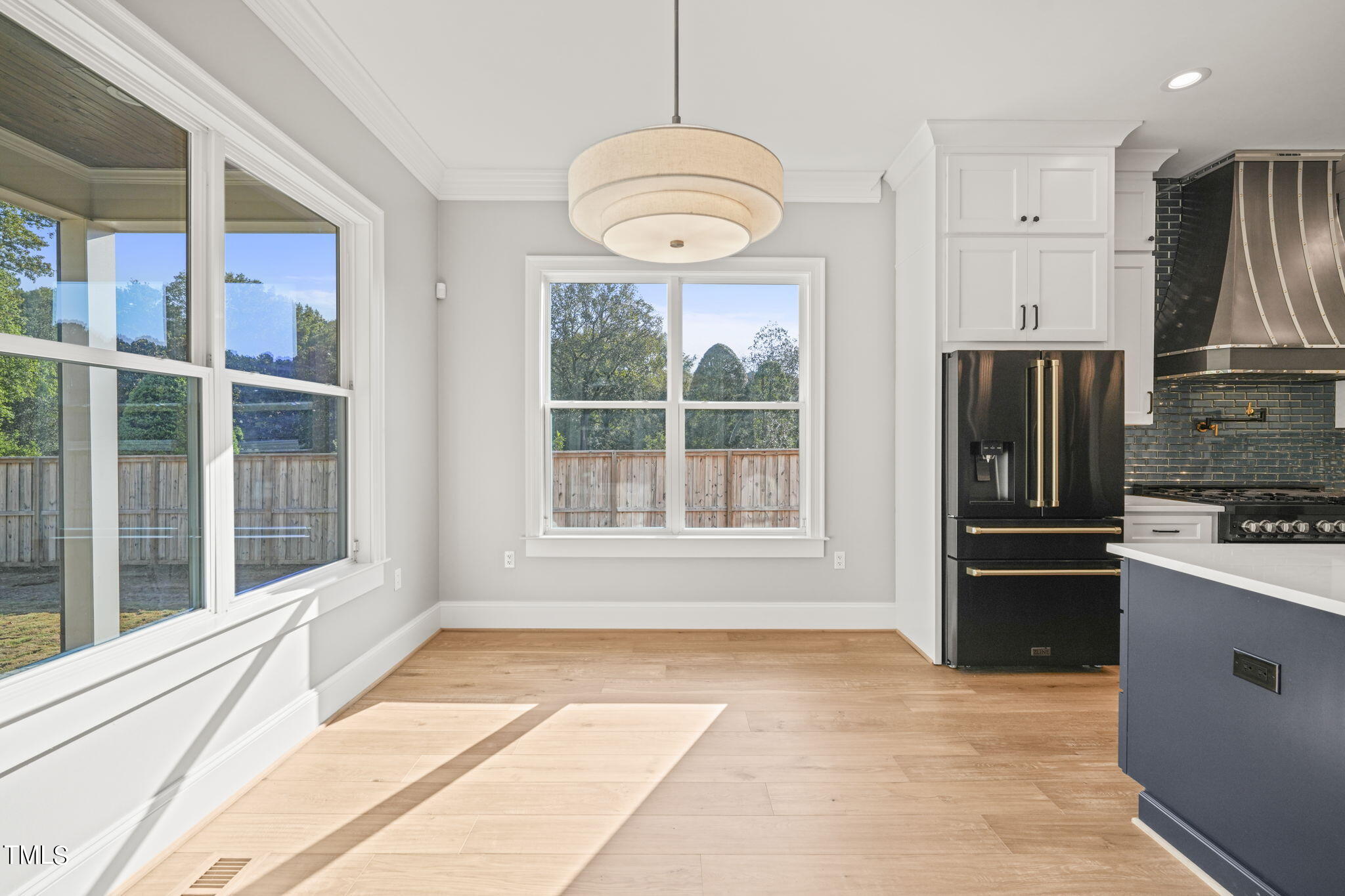 109 November Drive Durham, NC 27712 - Photo 17 of 57 a view of a kitchen with wooden floor and a refrigerator