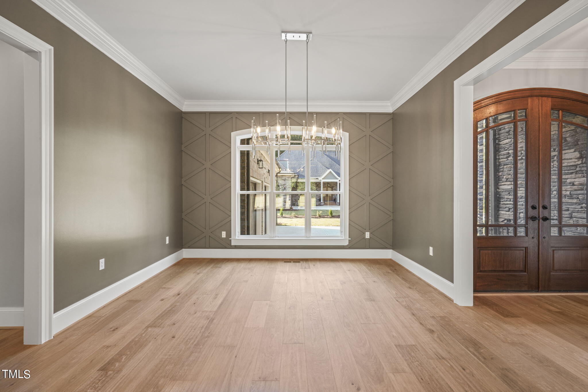 109 November Drive Durham, NC 27712 - Photo 20 of 57 a view of an empty room with wooden floor and a window