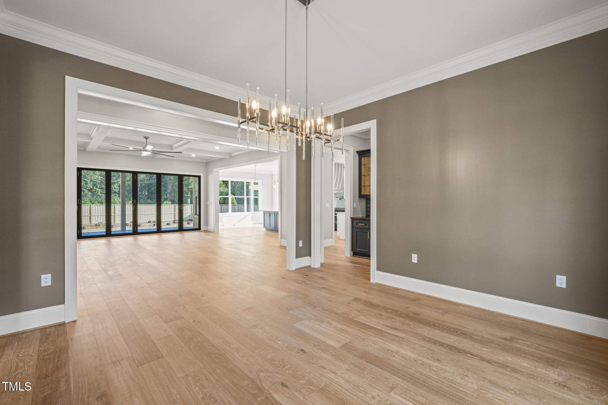 109 November Drive Durham, NC 27712 - Photo 21 of 57 a view of a livingroom with a chandelier fan and windows