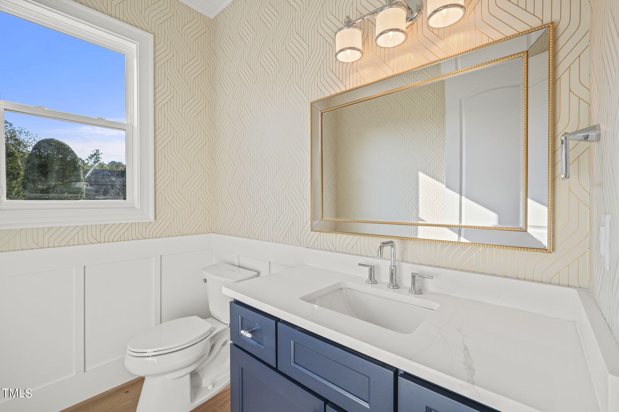 109 November Drive Durham, NC 27712 - Photo 22 of 57 a bathroom with a sink a toilet and a mirror