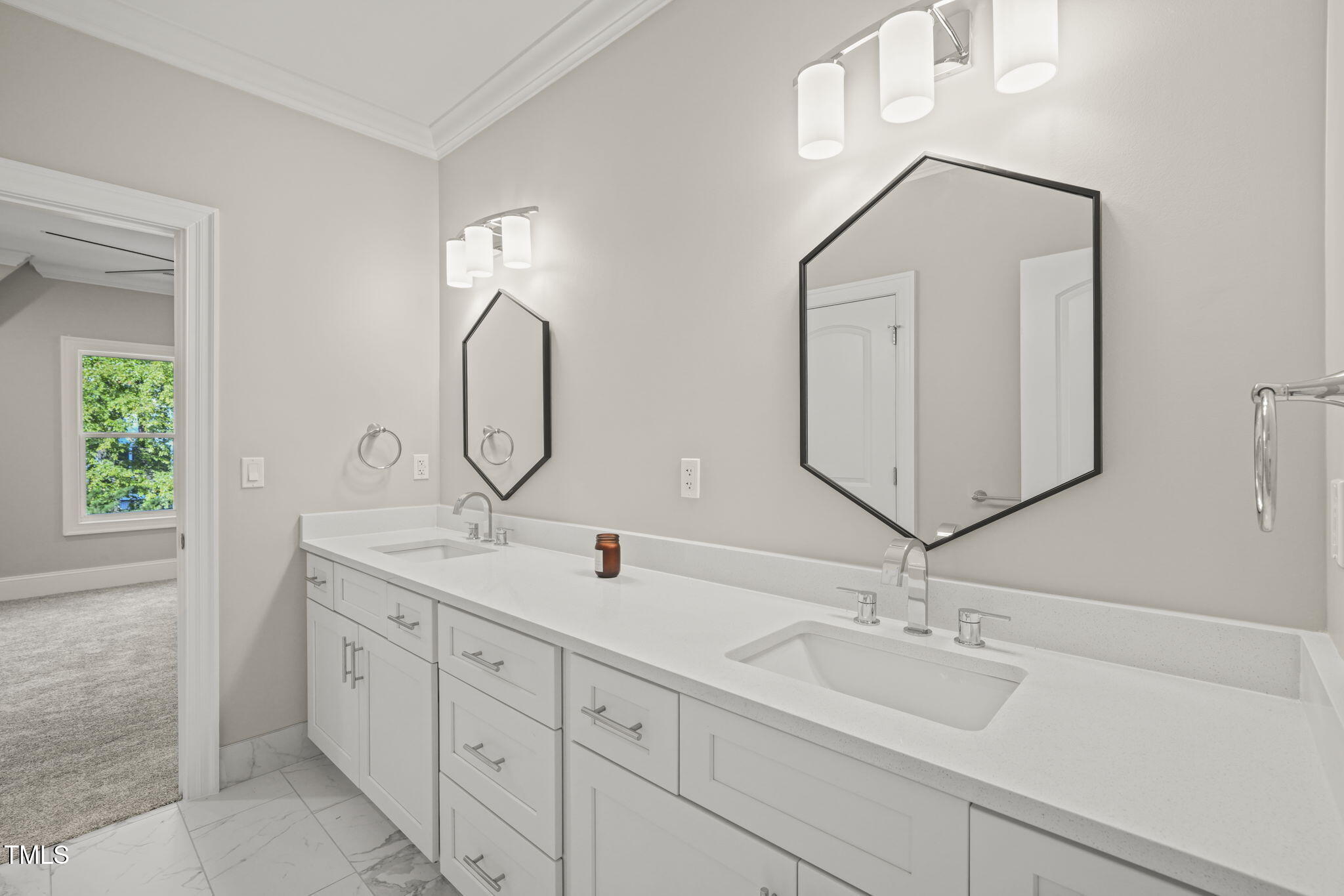 109 November Drive Durham, NC 27712 - Photo 46 of 57 a bathroom with a double vanity sink and a mirror