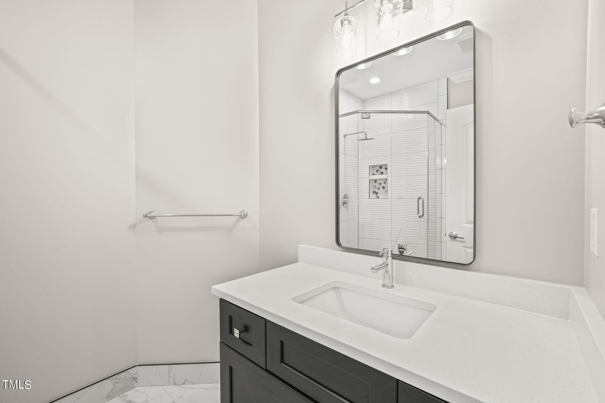 109 November Drive Durham, NC 27712 - Photo 49 of 57 a bathroom with a sink and a mirror