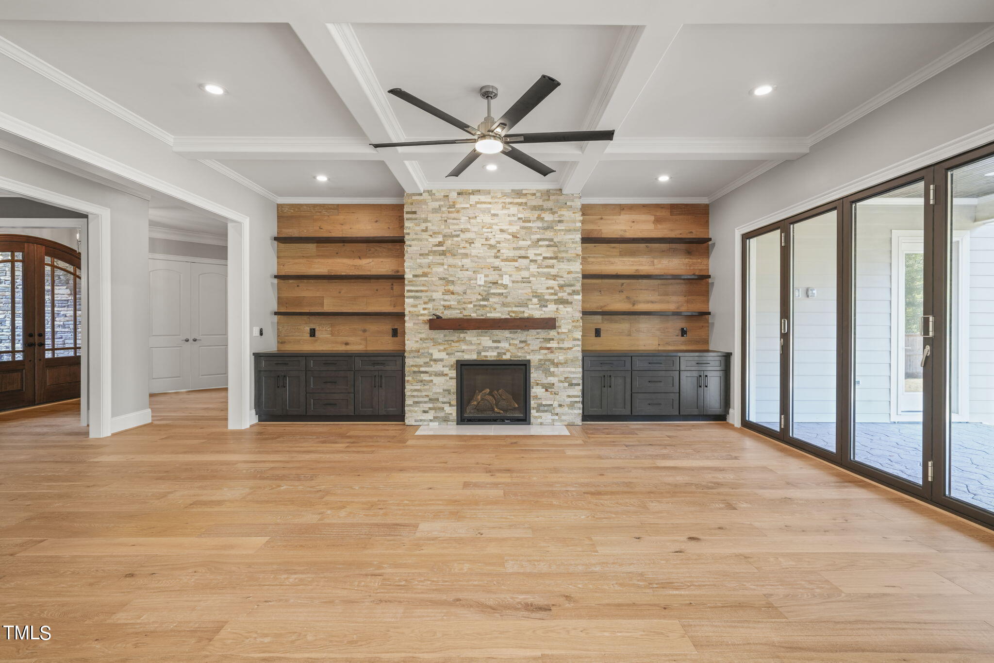 109 November Drive Durham, NC 27712 - Photo 6 of 57 a view of a livingroom with a fireplace a ceiling fan and window