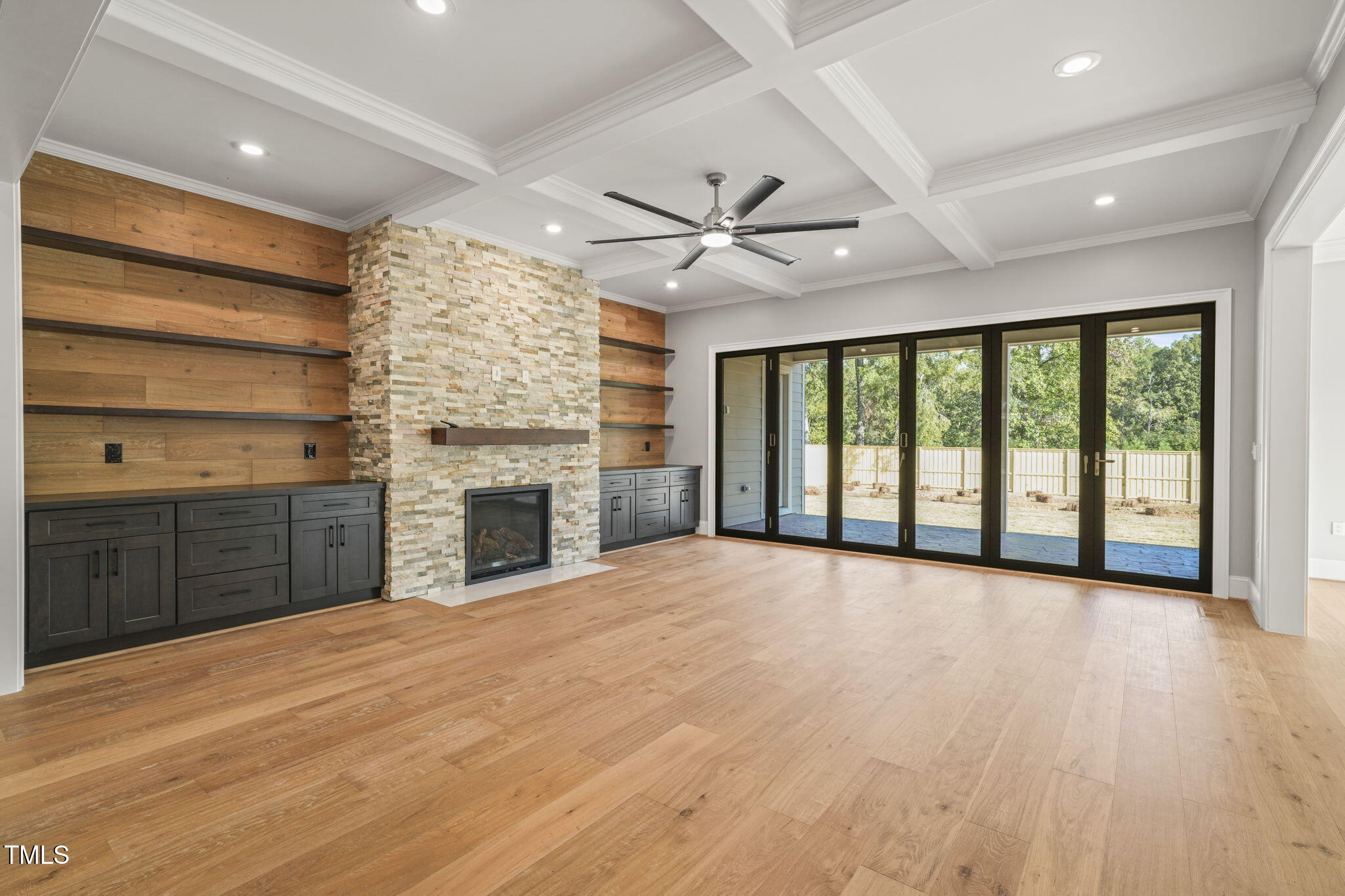 109 November Drive Durham, NC 27712 - Photo 7 of 57 a view of an empty room with a fireplace and a window