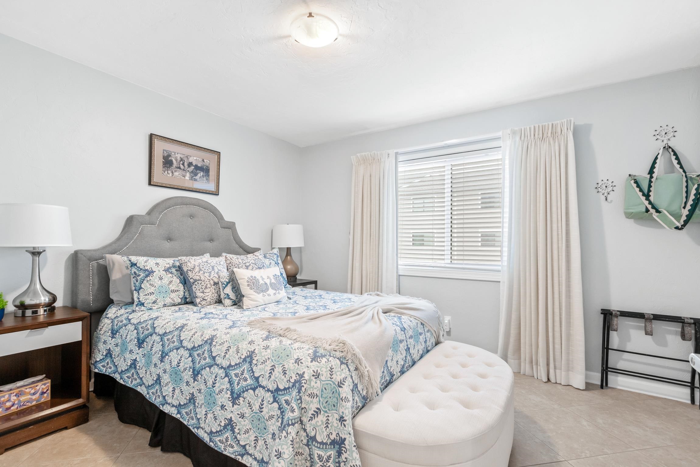 3385 Coastal Highway, Unit 22 St. Augustine, FL 32084 - Photo 14 of 35 a bedroom with a bed and a window