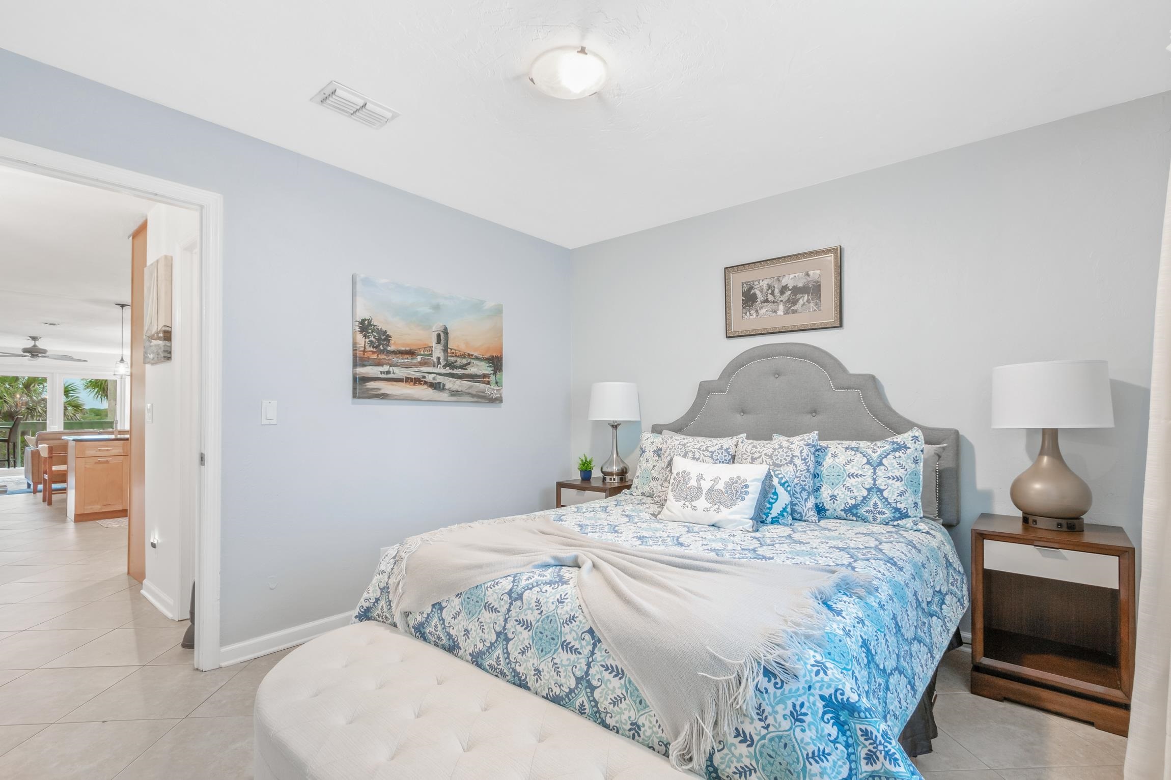 3385 Coastal Highway, Unit 22 St. Augustine, FL 32084 - Photo 15 of 35 a bedroom with a bed and a lamp
