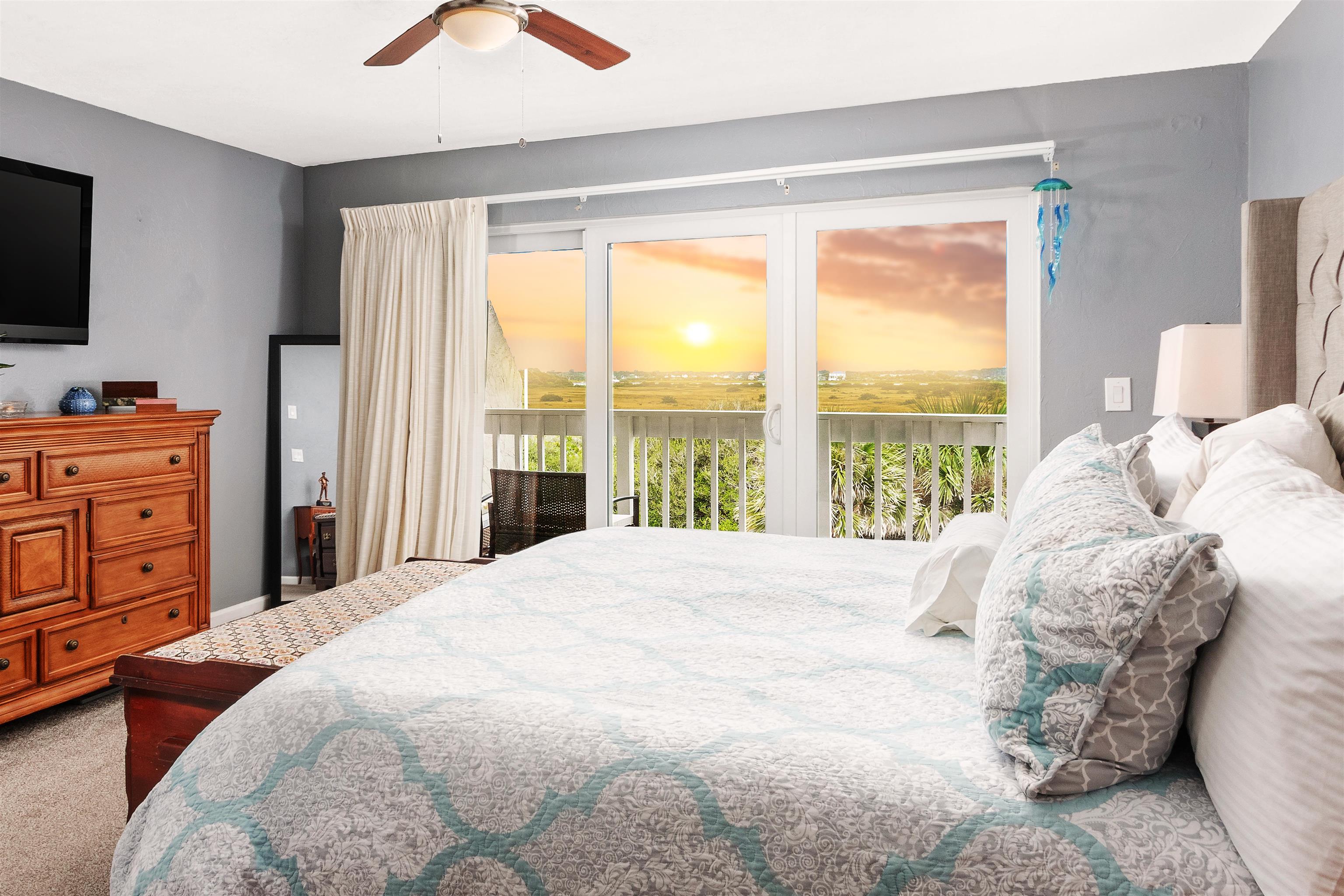 3385 Coastal Highway, Unit 22 St. Augustine, FL 32084 - Photo 20 of 35 a large bed sitting in a bedroom next to a window