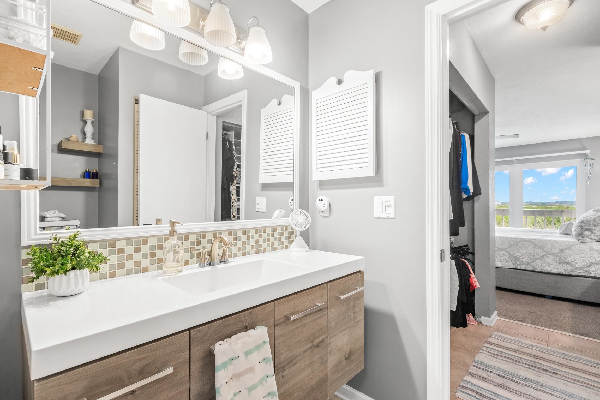 3385 Coastal Highway, Unit 22 St. Augustine, FL 32084 - Photo 27 of 35 a bathroom with a sink and a mirror