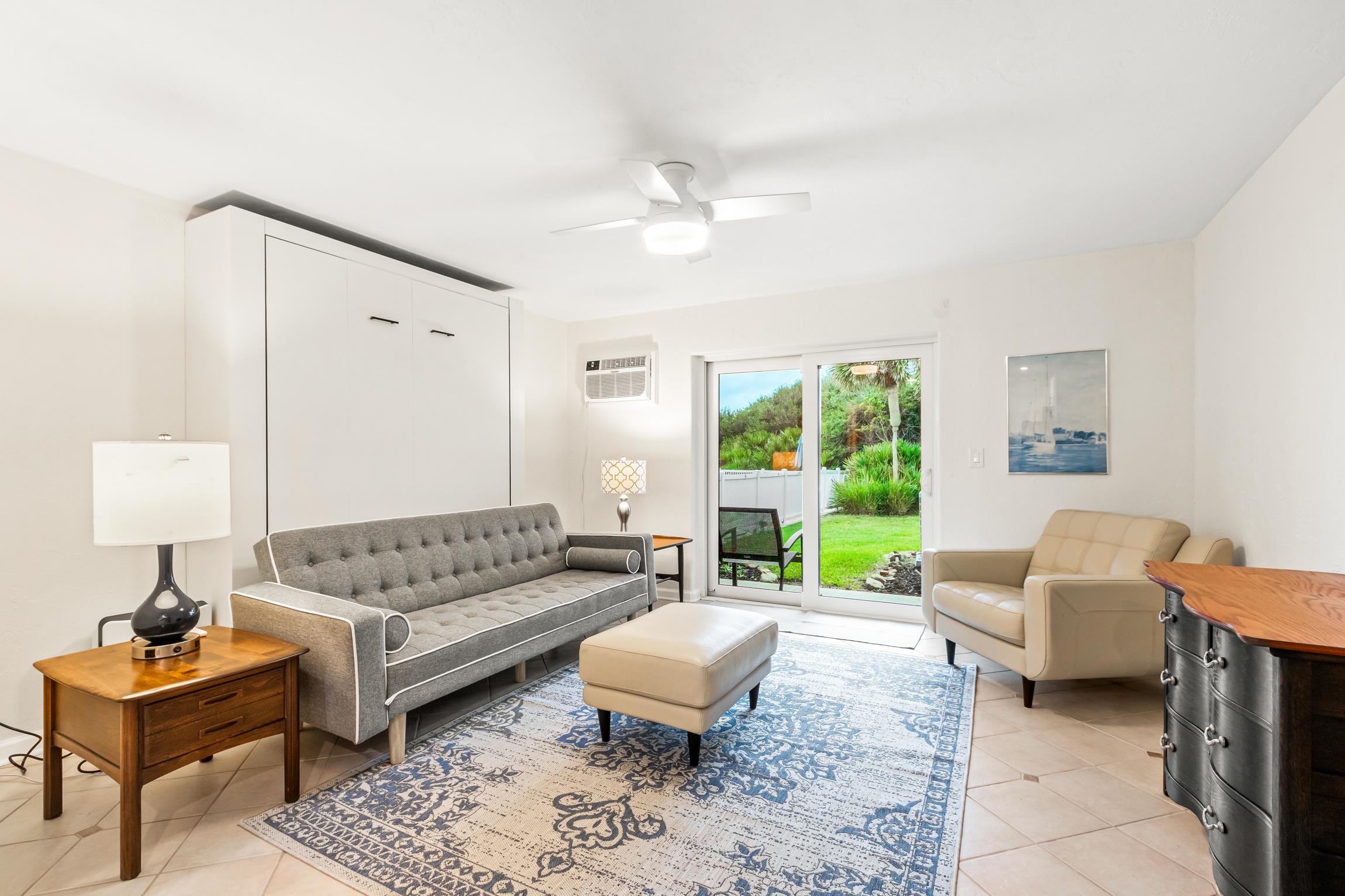 3385 Coastal Highway, Unit 22 St. Augustine, FL 32084 - Photo 33 of 35 a living room with furniture and a large window