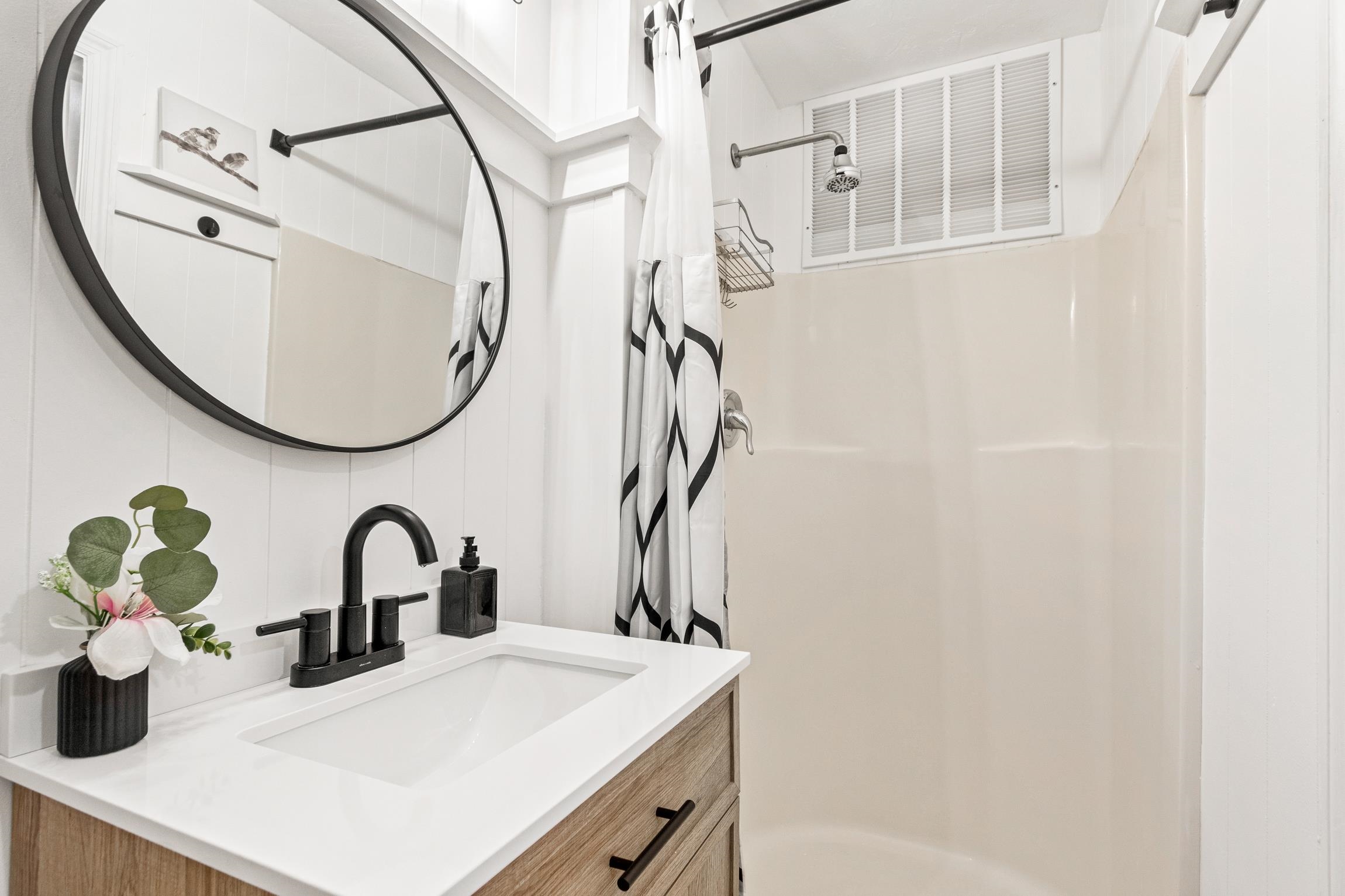 3385 Coastal Highway, Unit 22 St. Augustine, FL 32084 - Photo 34 of 35 a bathroom with a sink and a mirror