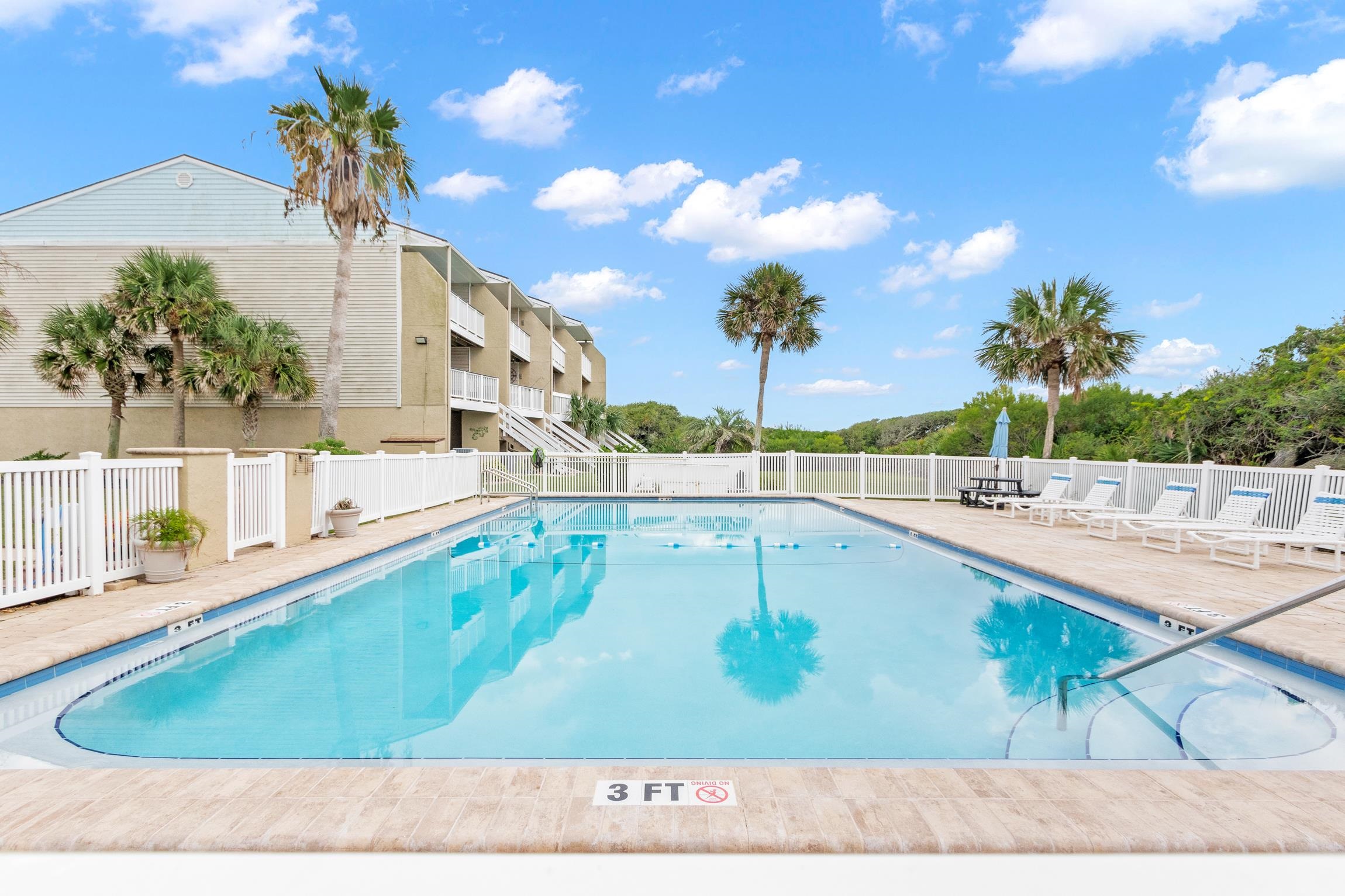 3385 Coastal Highway, Unit 22 St. Augustine, FL 32084 - Photo 35 of 35 a view of a swimming pool with a patio