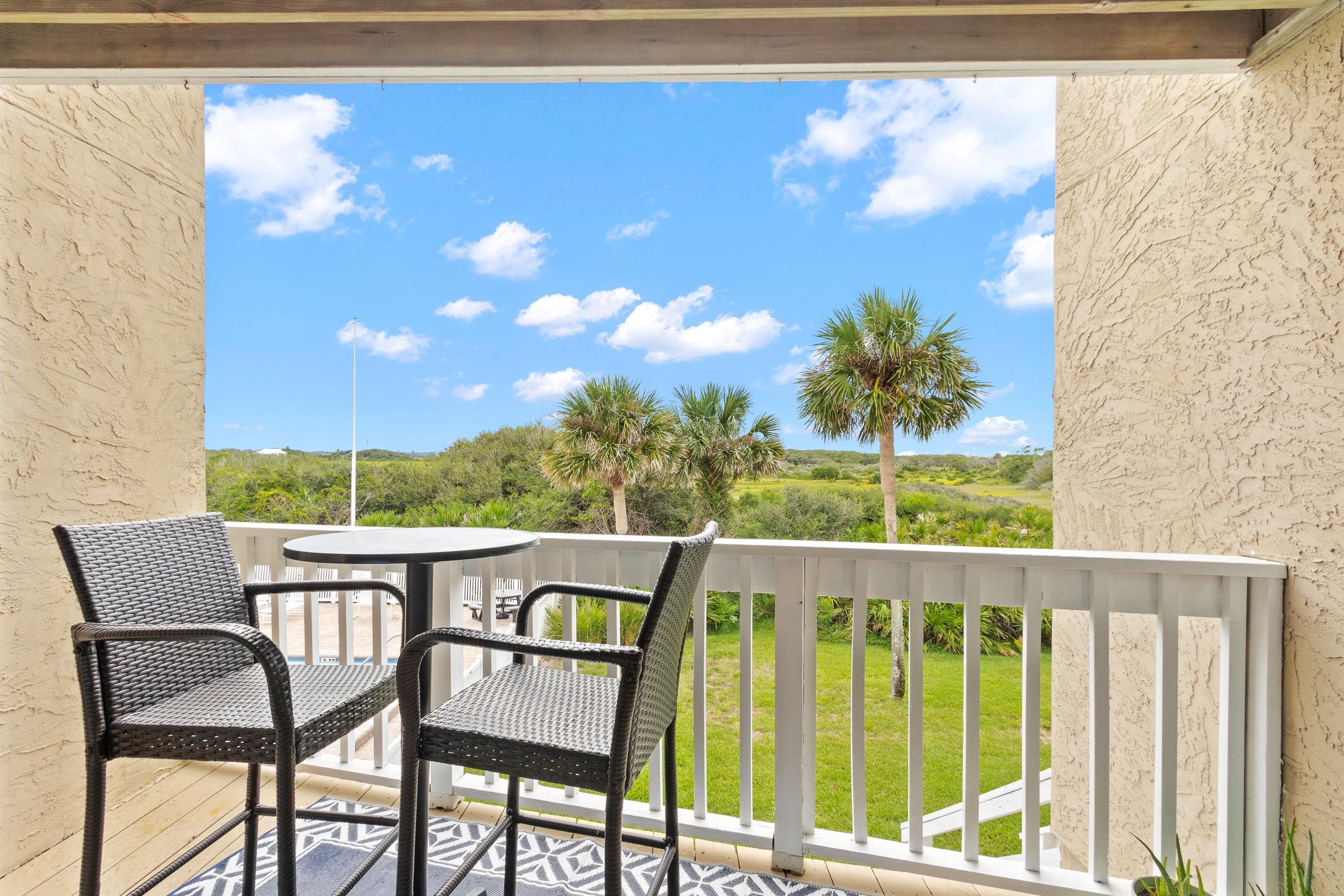 3385 Coastal Highway, Unit 22 St. Augustine, FL 32084 - Photo 9 of 35 a view of a chair and table in the balcony