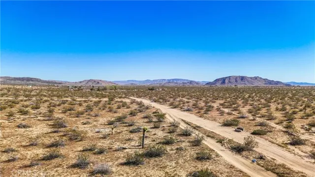 a view of a mountain with a mountain in the background