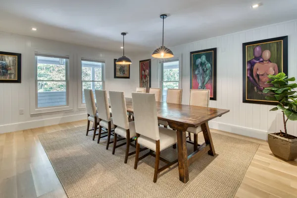 a view of a dining room with furniture window and outside view