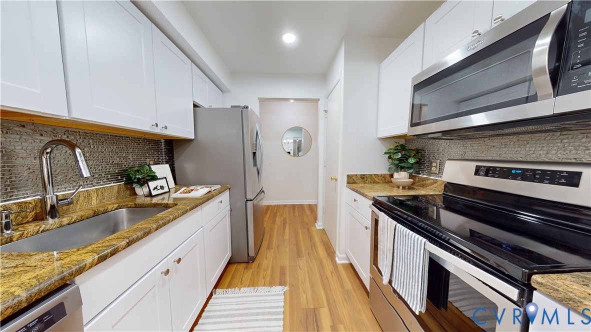 2106 Turtle Run Drive, Unit 7 Henrico, VA 23233 - Photo 4 of 22 a kitchen with granite countertop stainless steel appliances and wooden cabinets