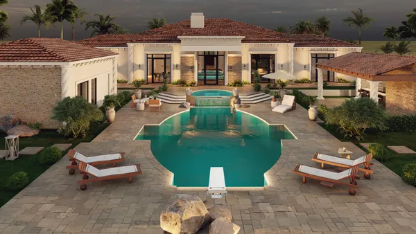 an aerial view of a house with swimming pool and garden view