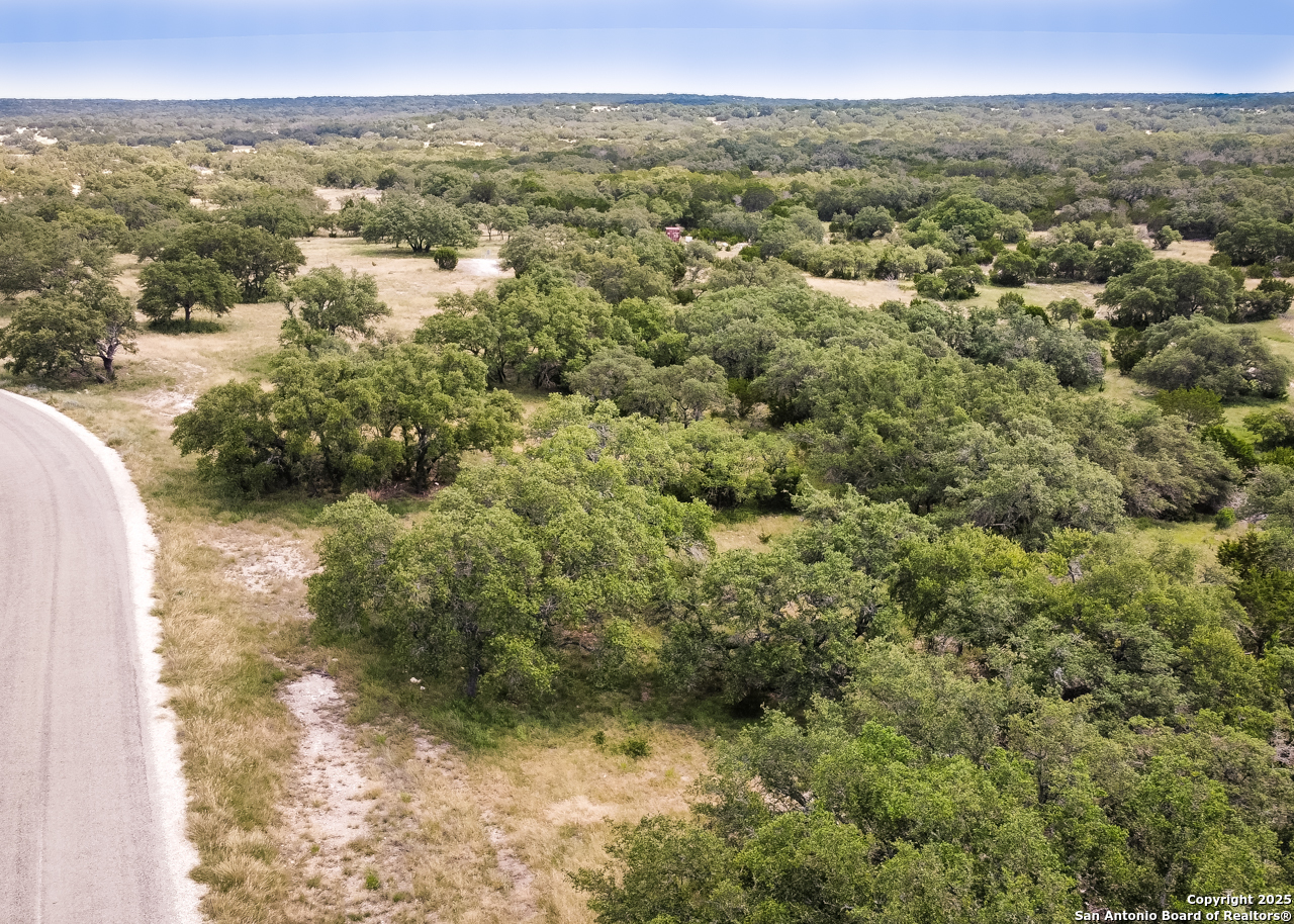 1303 Taurus Ln Junction Junction, TX 76849 - Photo 22 of 38 a view of a lake from a yard