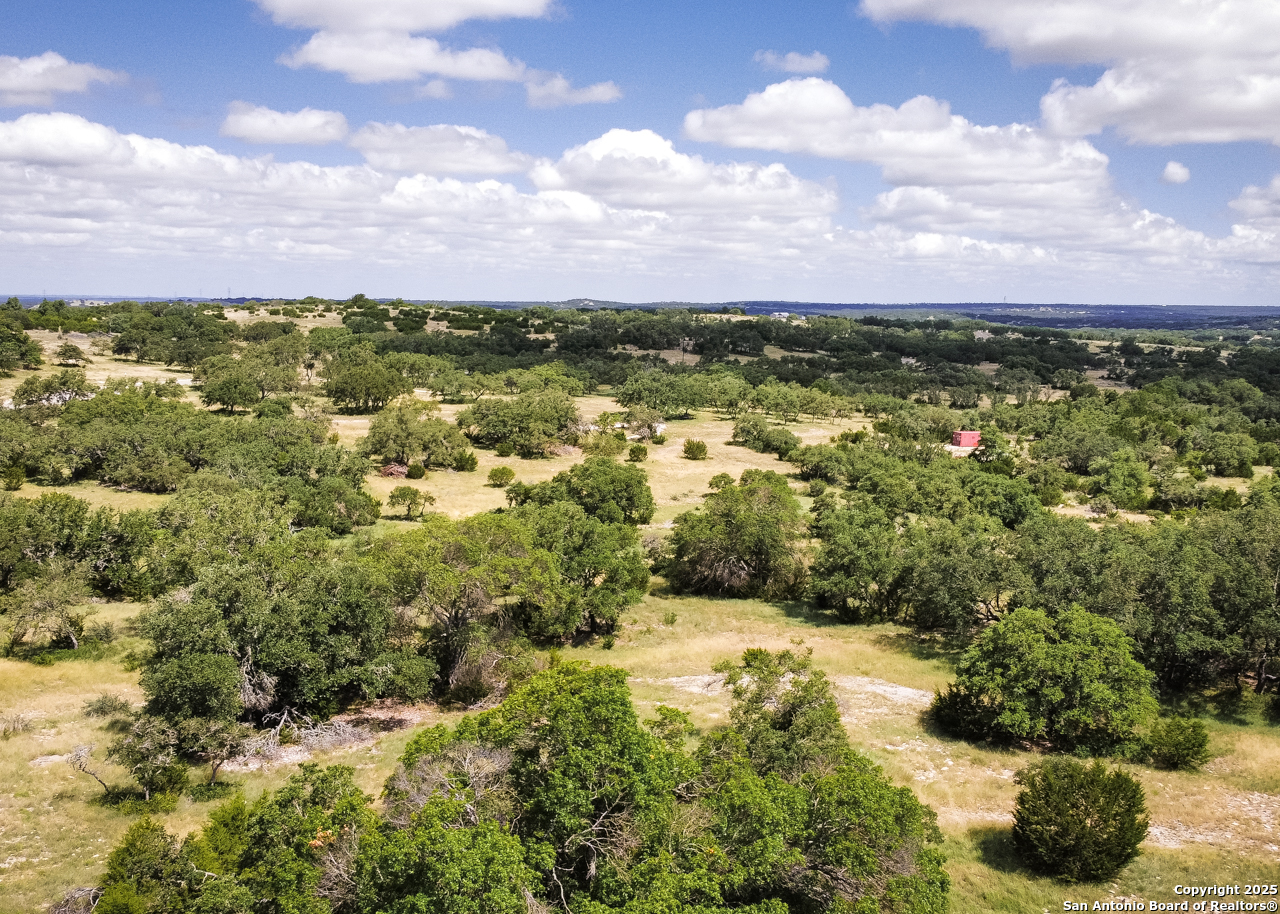 1303 Taurus Ln Junction Junction, TX 76849 - Photo 26 of 38 a view of a city with lush green forest