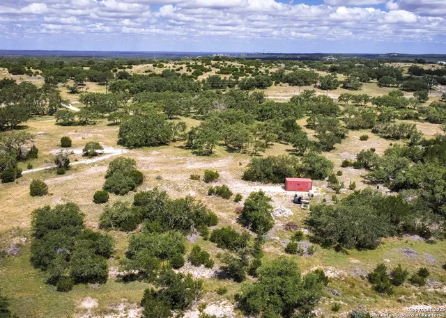 a view of a in front of a house with a yard