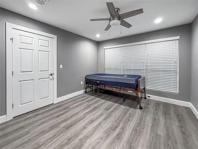 a room with a table and wooden floor