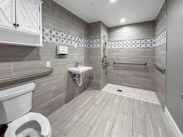 a bathroom with a sink and a shower