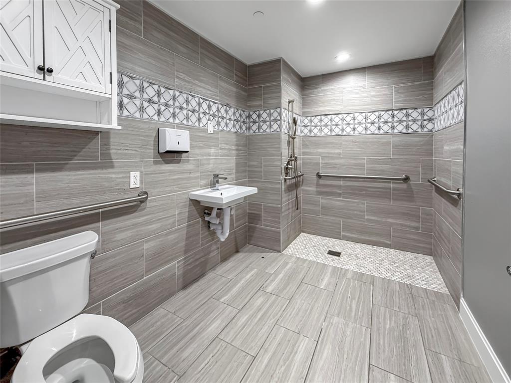 2402 Country Valley Road Garland, TX 75041 - Photo 28 of 39 a bathroom with a sink and a shower