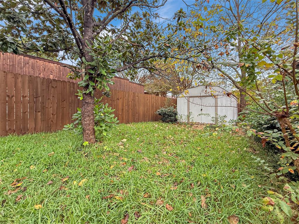 2402 Country Valley Road Garland, TX 75041 - Photo 33 of 39 a backyard of a house with lots of green space
