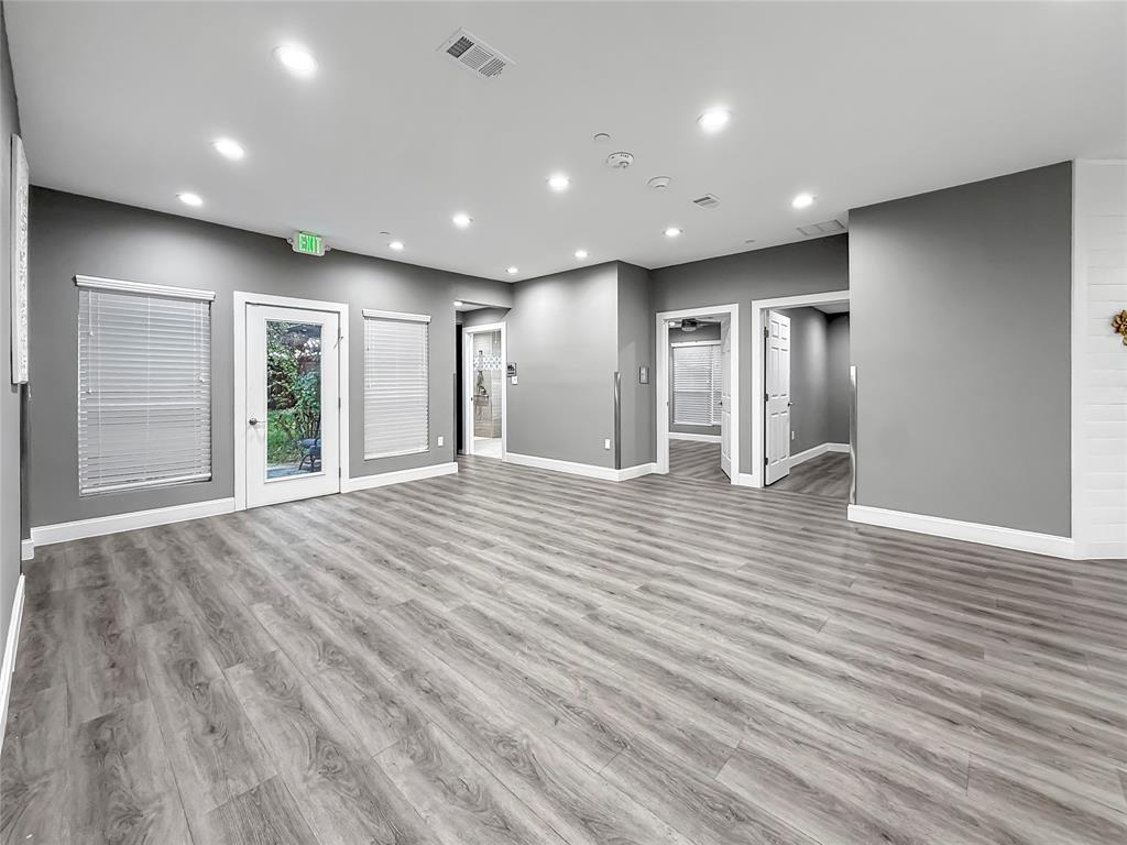 2402 Country Valley Road Garland, TX 75041 - Photo 9 of 39 a view of empty room with wooden floor