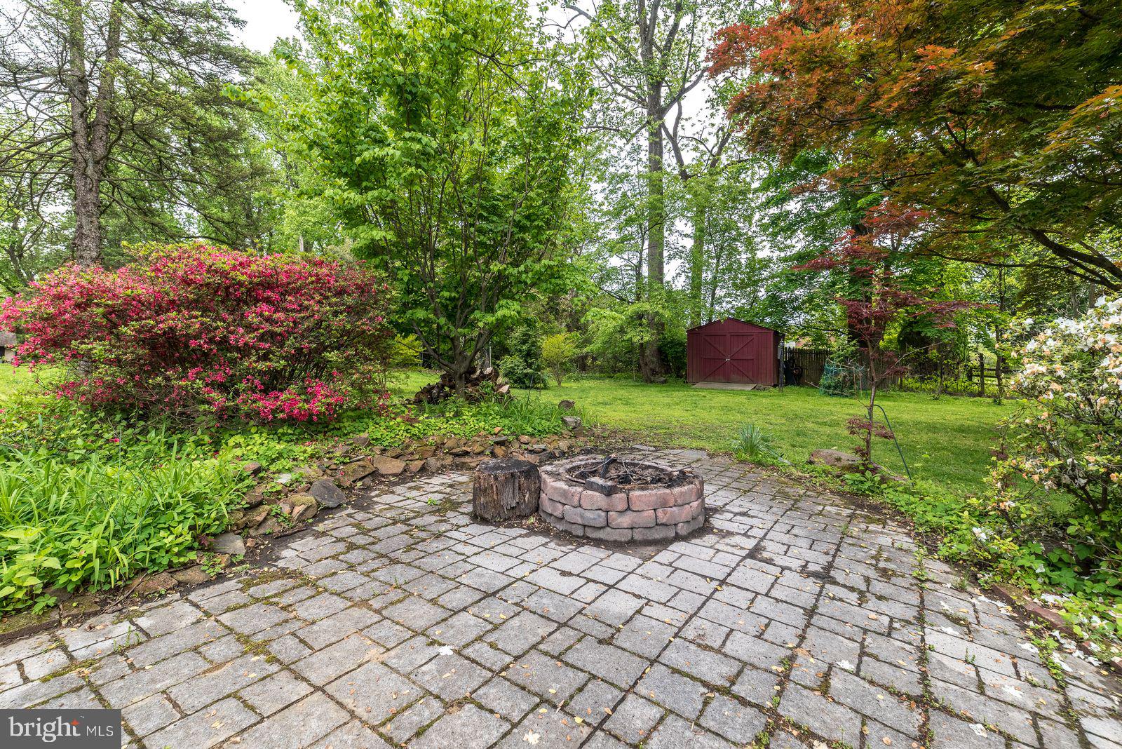 534 Pinney Road Huntingdon Valley, PA 19006 - Photo 26 of 26 a view of a backyard with table and chairs and potted plants