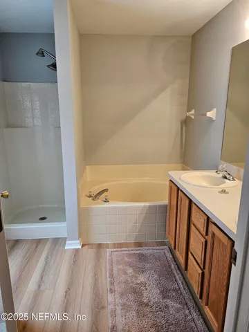 a bathroom with a bathtub and a sink