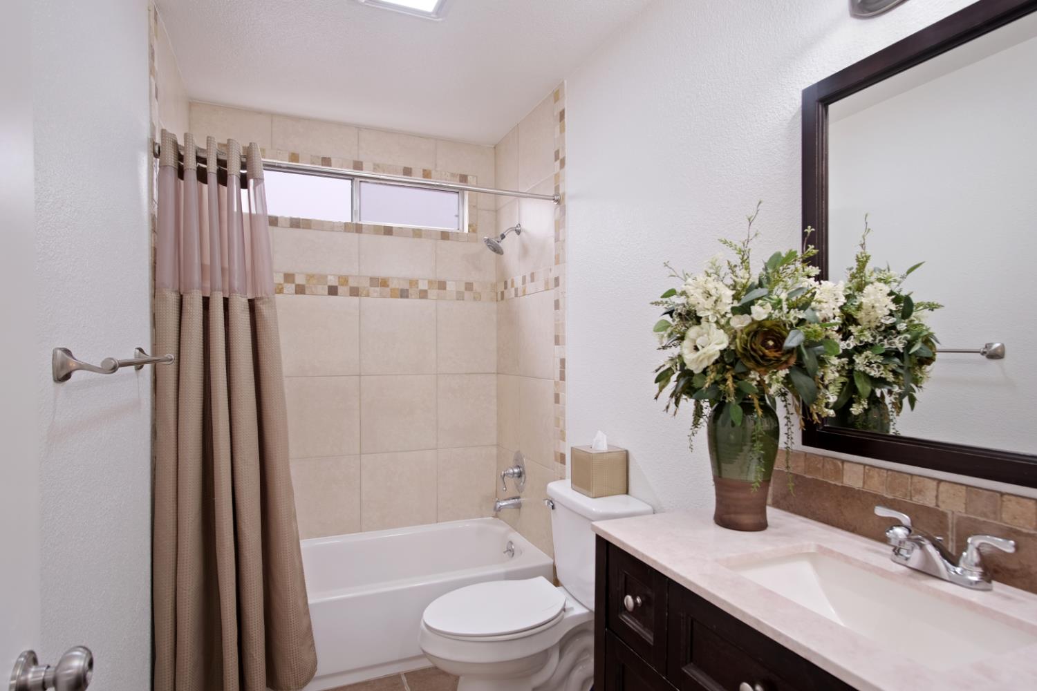 1921 Carleton Drive Turlock, CA 95382 - Photo 16 of 26 a bathroom with a sink a toilet a tub and shower