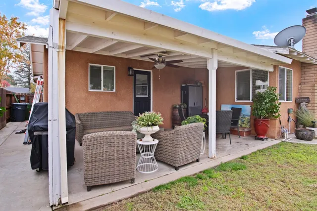 a view of house with patio outdoor seating