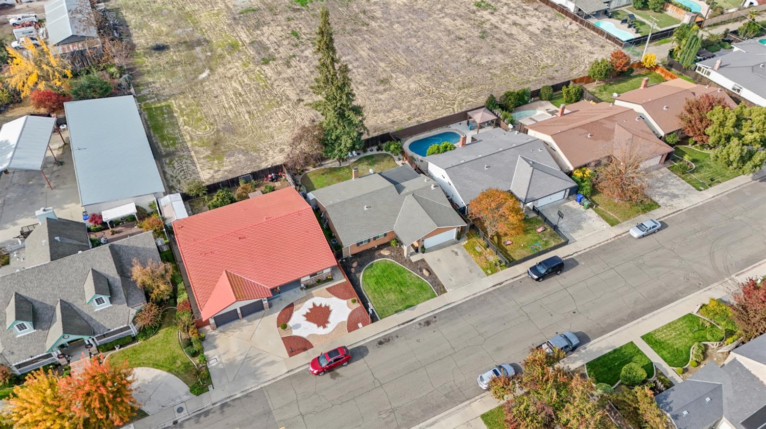 1921 Carleton Drive Turlock, CA 95382 - Photo 24 of 26 an aerial view of a house with a yard and a large tree